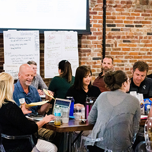 teachers talking to each other at tables