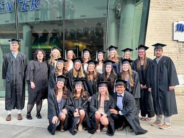 Students in graduation caps and gowns