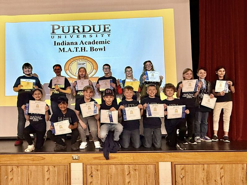 Students posing with math certificates