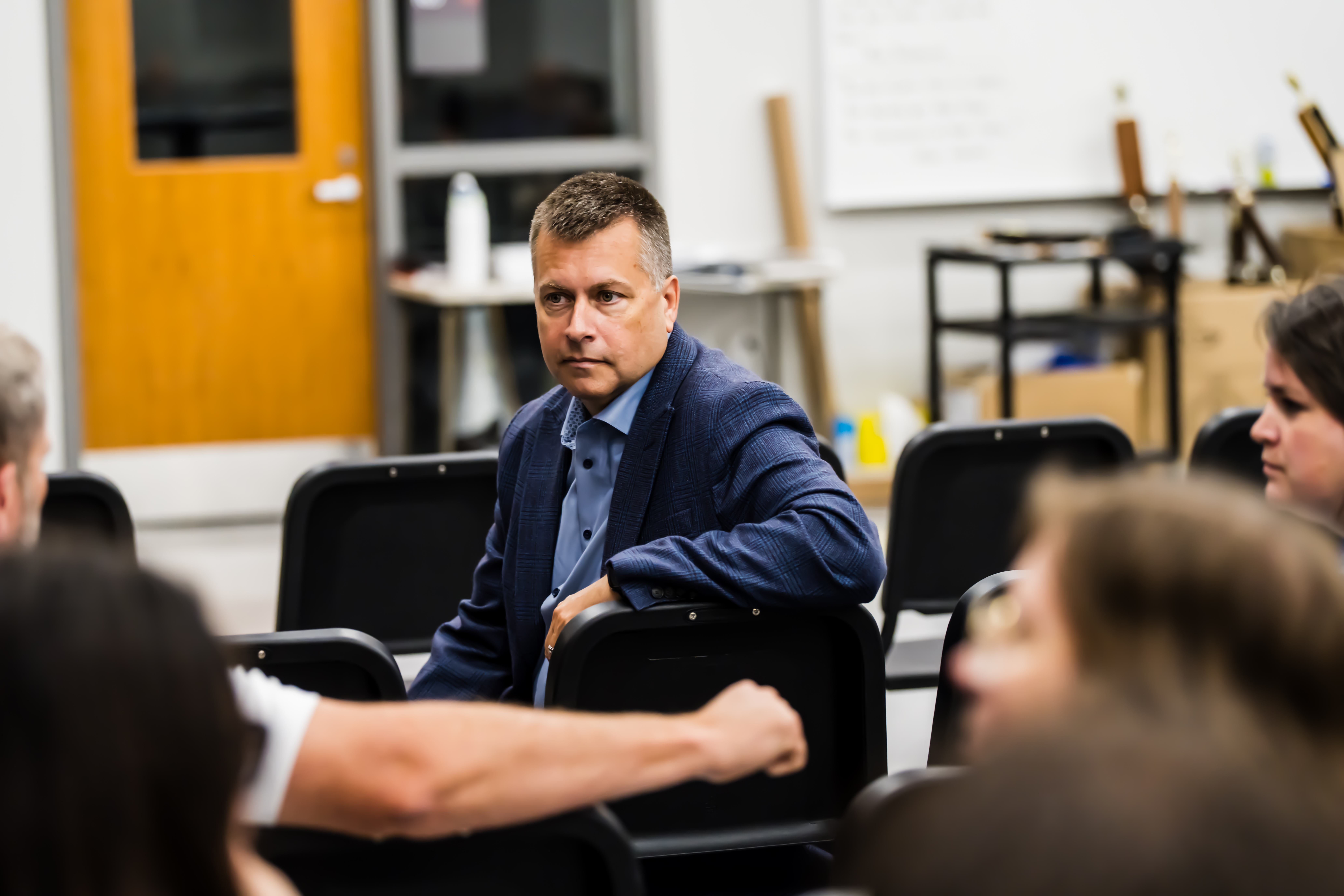 CELL executive director Carey Dahncke talking with educators in a classroom