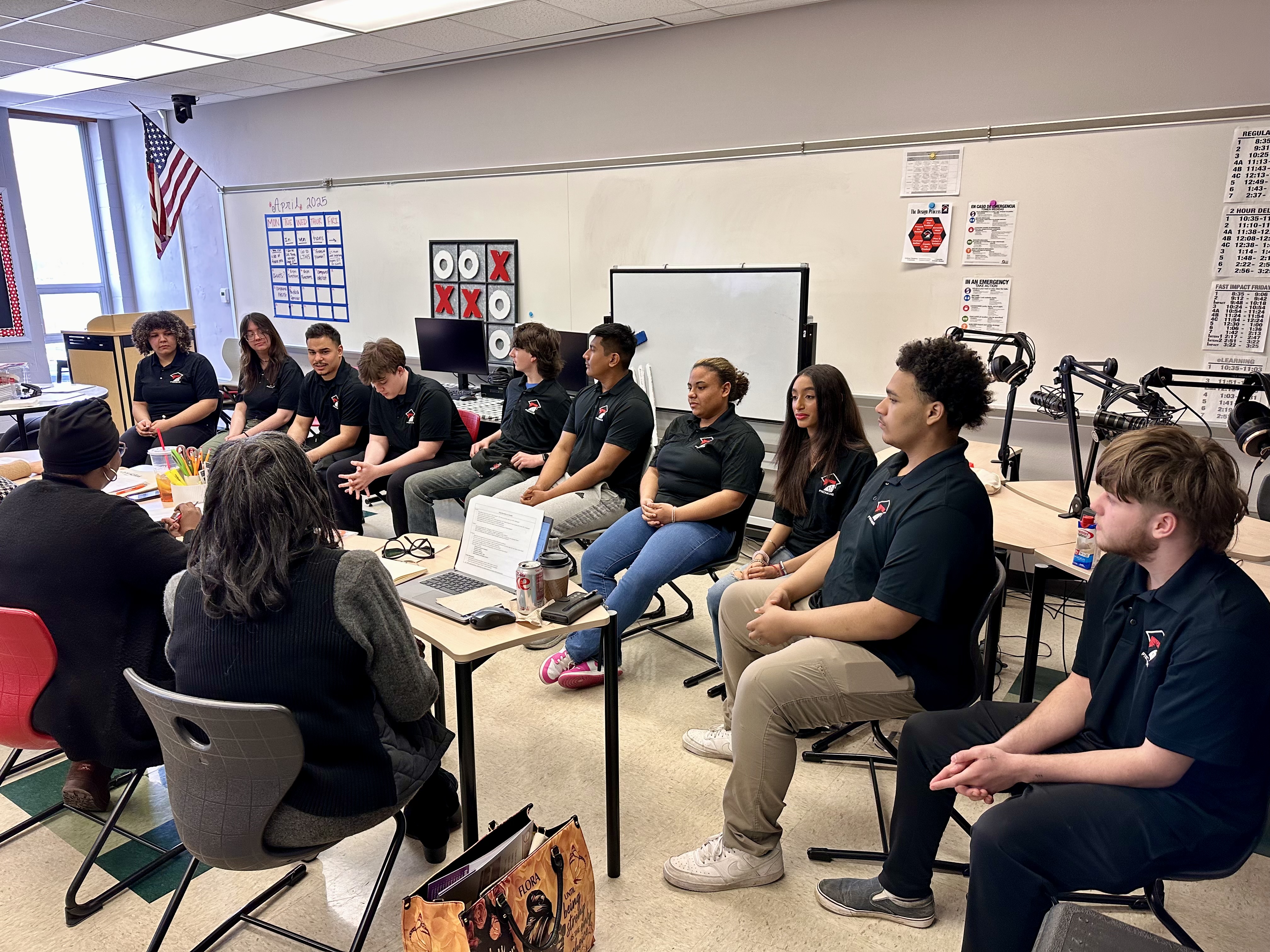 Logansport P-CAP students present to visitors from the IDOE