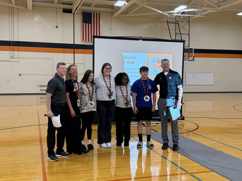 Students and staff with championship chains for "living on mission"