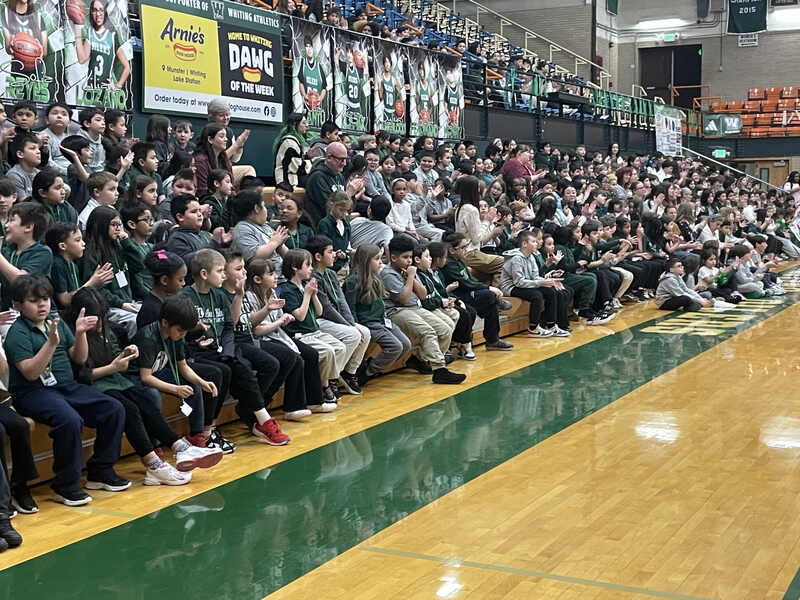 Students and staff gather to receive a Celebrate Your School Award