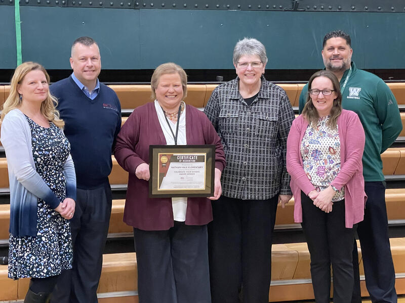 CELL staff presenting Nathan Hale leaders with a Celebrate Your School Award